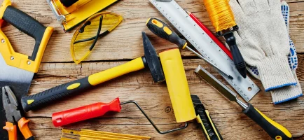 set-construction-tools-wooden-background-top-view