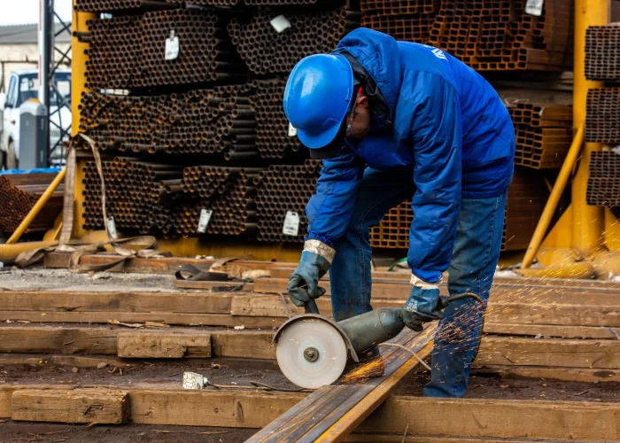 worker-cuts-iron-with-tool_converted