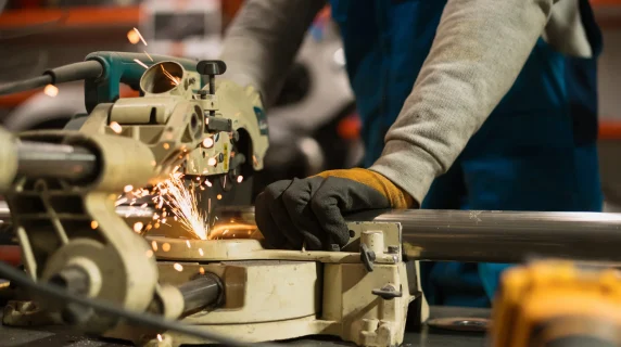 worker-working-with-circular-grinder-metal-with-sparks